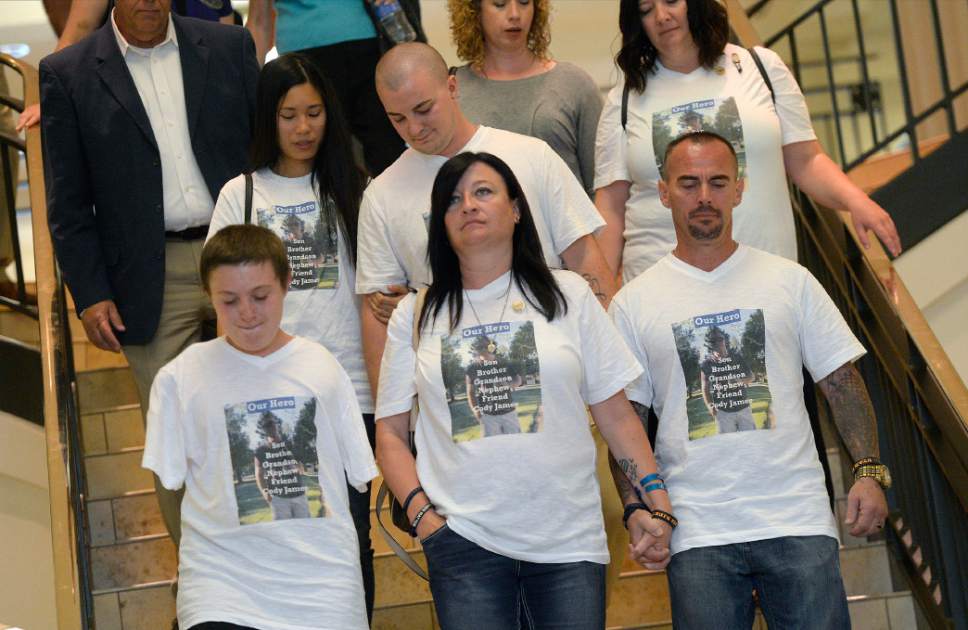 Al Hartmann  |  The Salt LakeTribune
Family members of fallen West Valley City police officer Cody Brotherson,  Alex, left,  Jenny and Jeff Brotherson  leave court in Salt Lake City, Monday July 10, 2017.  Three teenage boys who admitted responsibility for the November death of West Valley City police Officer Cody Brotherson were ordered by a juvenille judge to serve time in a secure juvenile care facility for as long as possible. 
West Valley Police officer Cody Brotherson, 25, was killed Nov. 6 when he was struck by a stolen vehicle -- in which the three teens were riding -- while laying down a set of spike strips.