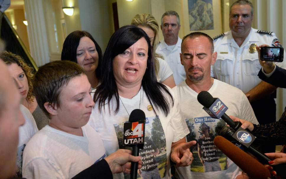 Al Hartmann  |  The Salt LakeTribune
Family members of fallen West Valley City police officer Cody Brotherson,  Alex, 9, (brother), left, Jenny, (Mother), and Jeff Brotherson, (Father), talk to the media upon leaving court in Salt Lake City, Monday July 10, 2017.  Three teenage boys who admitted responsibility for the November death of West Valley City police Officer Cody Brotherson were ordered by a juvenille judge to serve time in a secure juvenile care facility for as long as possible. 
West Valley Police officer Cody Brotherson, 25, was killed Nov. 6 when he was struck by a stolen vehicle -- in which the three teens were riding -- while laying down a set of spike strips.