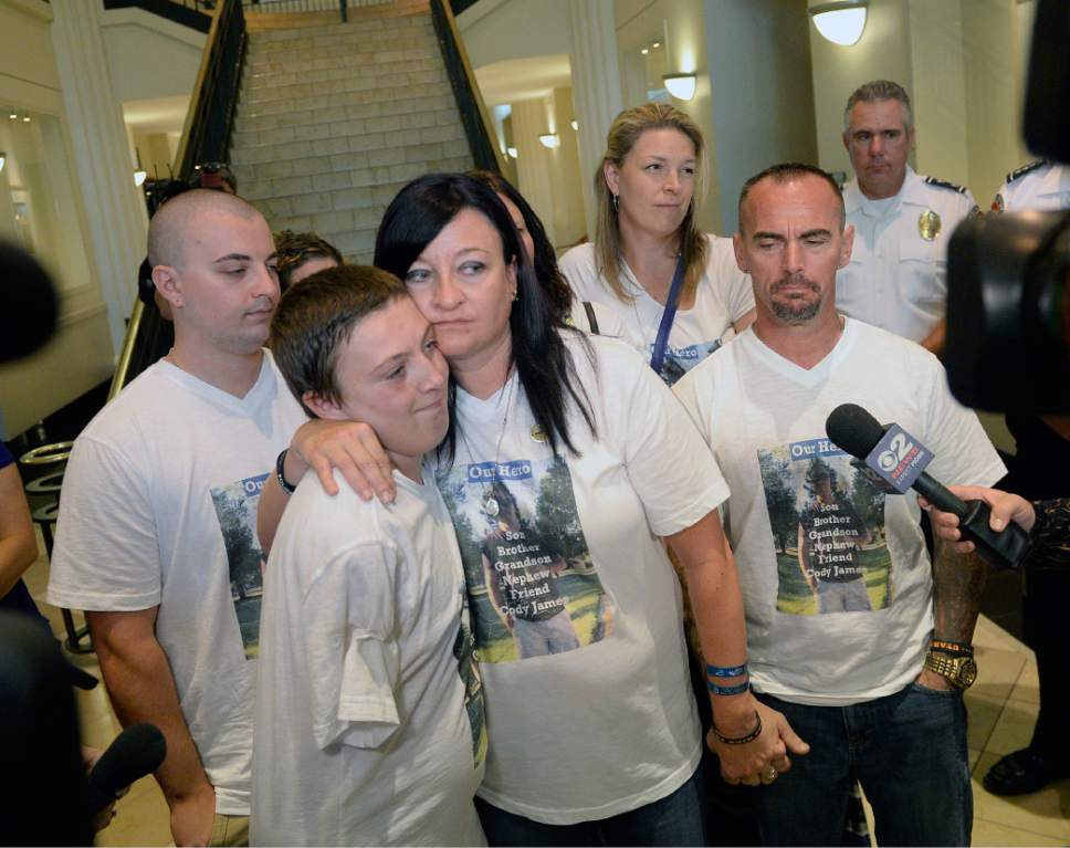 Al Hartmann  |  The Salt LakeTribune
Family members of fallen West Valley City police officer Cody Brotherson,  Alex, 9, (brother) left, Jenny, (Mother), and Jeff Brotherson, (Father), talk to the media upon leaving court in Salt Lake City, Monday July 10, 2017.  Three teenage boys who admitted responsibility for the November death of West Valley City police Officer Cody Brotherson were ordered by a juvenille judge to serve time in a secure juvenile care facility for as long as possible. 
West Valley Police officer Cody Brotherson, 25, was killed Nov. 6 when he was struck by a stolen vehicle -- in which the three teens were riding -- while laying down a set of spike strips.