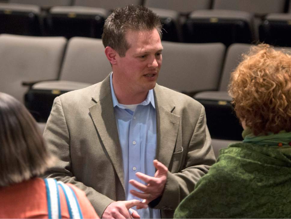 Rick Egan  |  The Salt Lake Tribune

Tribune reporter Nate Carlisle visits with a guest after the Trib Talk Live: Polygamy in Short Creek presentation, at the Salt Lake Library, Wednesday, March 2, 2016.