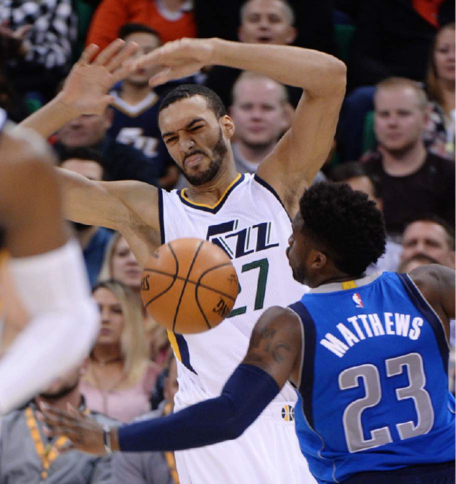 Steve Griffin / The Salt Lake Tribune


Utah Jazz center Rudy Gobert (27) grimaces as he gets the ball swatted out of his arms by Dallas Mavericks guard Wesley Matthews (23) during NBA game at Vivint Smarthome Arena in Salt Lake City Wednesday November 2, 2016.