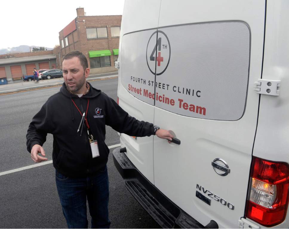 Al Hartmann  |  The Salt Lake Tribune
Phil Taylor, nurse practitioner for the Fourth Street Clinic hits the streets in Salt lake City Wednesday December 4 in the clinic's new mobile van to provide medical care for the homeless.  Exams are made inside the van but Taylor makes "house calls" too.  The new van is becoming a familiar and trusted to the homeless community in the valley.