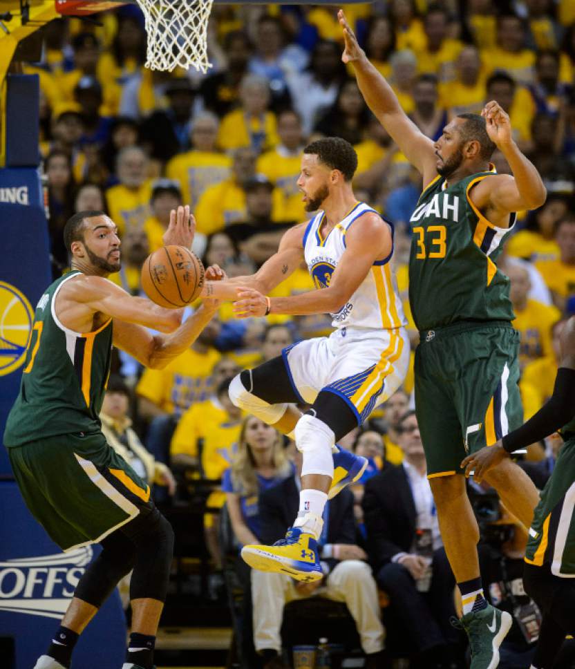 Steve Griffin  |  The Salt Lake Tribune


Golden State Warriors guard Stephen Curry (30) passes away from the Utah Jazz center Rudy Gobert (27) and Utah Jazz center Boris Diaw (33) during NBA playoff game between the Utah Jazz and the Golden State Warriors at Oracle Arena in Oakland Tuesday May 2, 2017.