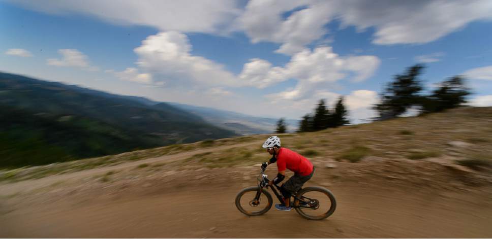 Trent Nelson  |  The Salt Lake Tribune
Mountain bikers on Deer Valleyís Holy Roller trail, Saturday July 8, 2017.