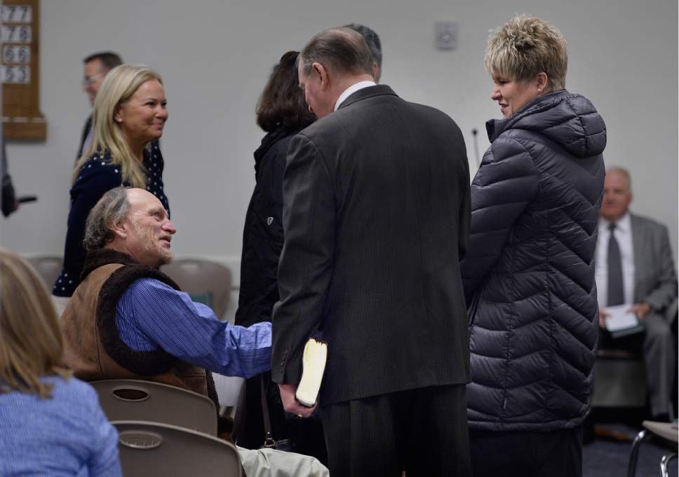 Scott Sommerdorf   |  The Salt Lake Tribune  
A homeless Gary Page, left, greets people arriving for a Mormon service for the homeless at the Rio Grande LDS Branch, Sunday, Jan. 29, 2017.
