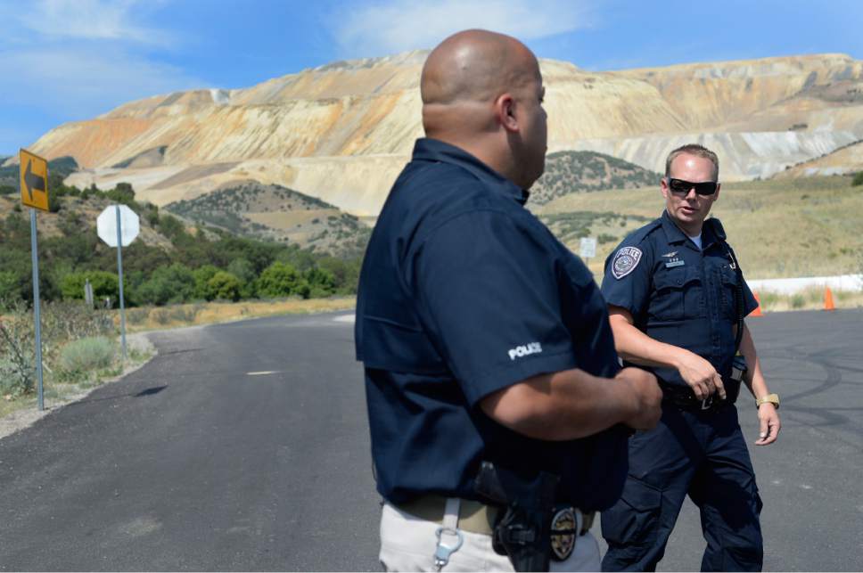 Scott Sommerdorf   |  The Salt Lake Tribune


Leiutenant Brian Lohrke, left, speaks with another officer near the roadblock of a plane crash scene where two people in a small plane died. Access to the area was blocked by FAA as they investigate the scene off Bingham Canyon Road near Kennecott on Thursday, July 13, 2017.