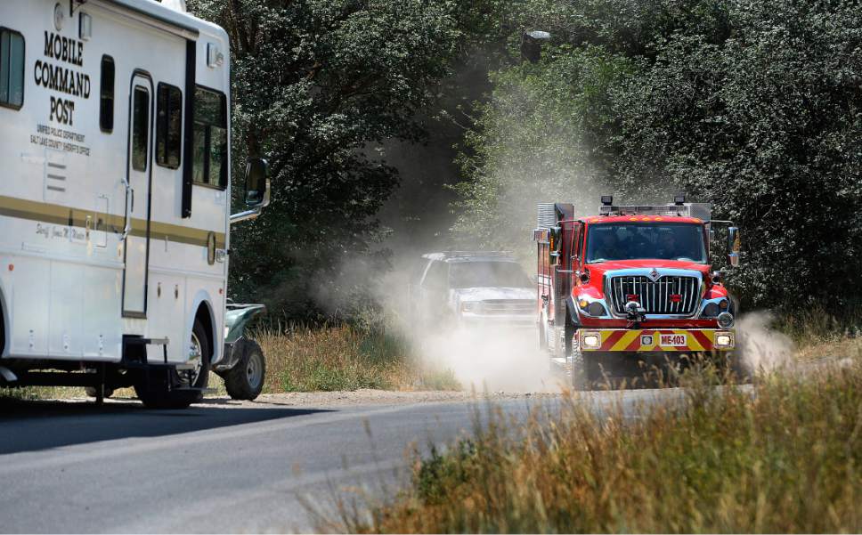 Scott Sommerdorf   |  The Salt Lake Tribune


A Herriman fire unit and a Unified Police SUV emerge from the dirt road that leads to the site of a small plane crash near Kennecott that killed two people on Thursday, July 13, 2017. The site of the crash was still being investigated by the FAA and was closed.