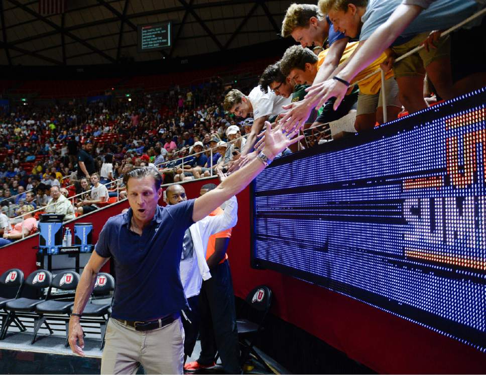 Francisco Kjolseth | The Salt Lake Tribune
Utah Jazz coach Quin Snyder gets high fives from the fans as the Jazz get ready to take on the Celtics during the NBA Summer league basketball game at the Huntsman Center, July 6, 2017, in Salt Lake City.