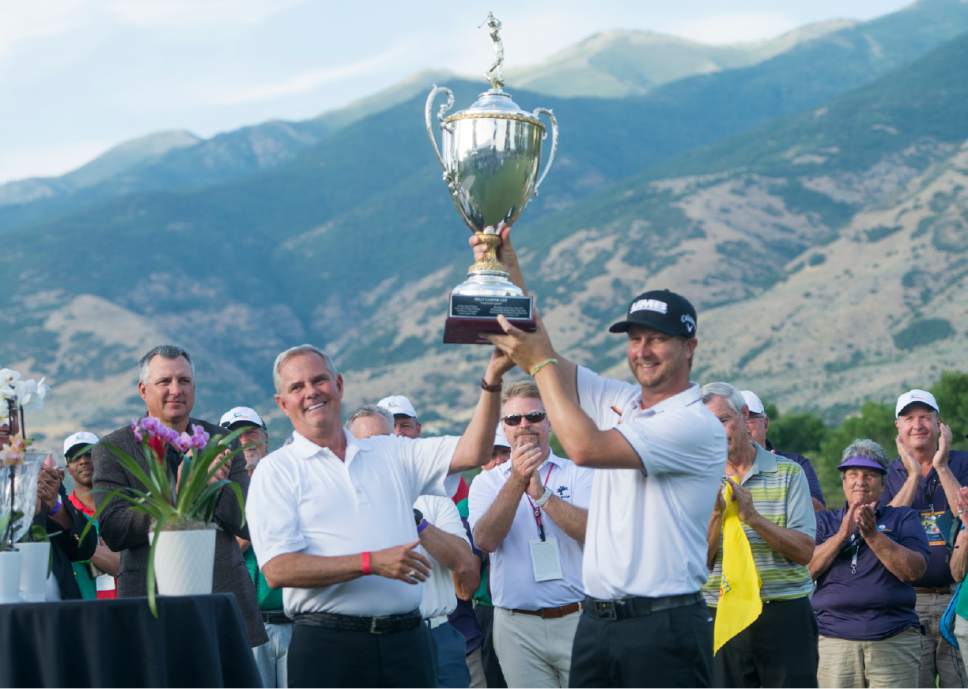 Rick Egan  |  The Salt Lake Tribune

Brice Garnett is presented the Billy Casper Cup by David Simmons on the 18th green at Oakridge Country Club in Farmington after he paced first in the Utah Championship Golf Tournament, Sunday, July 16, 2017.