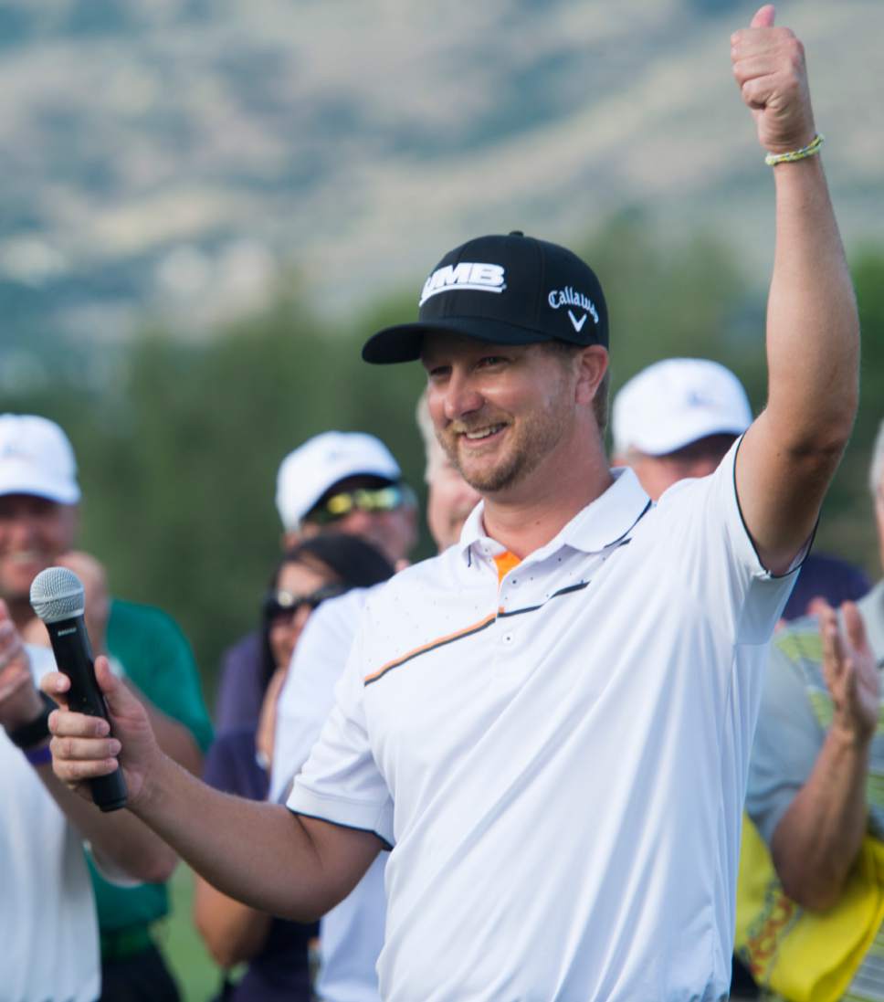 Rick Egan  |  The Salt Lake Tribune

Brice Garnett salutes the crowd after winning the Utah Championship Golf Tournament, at Oakridge Country Club in Farmington, Sunday, July 16, 2017.