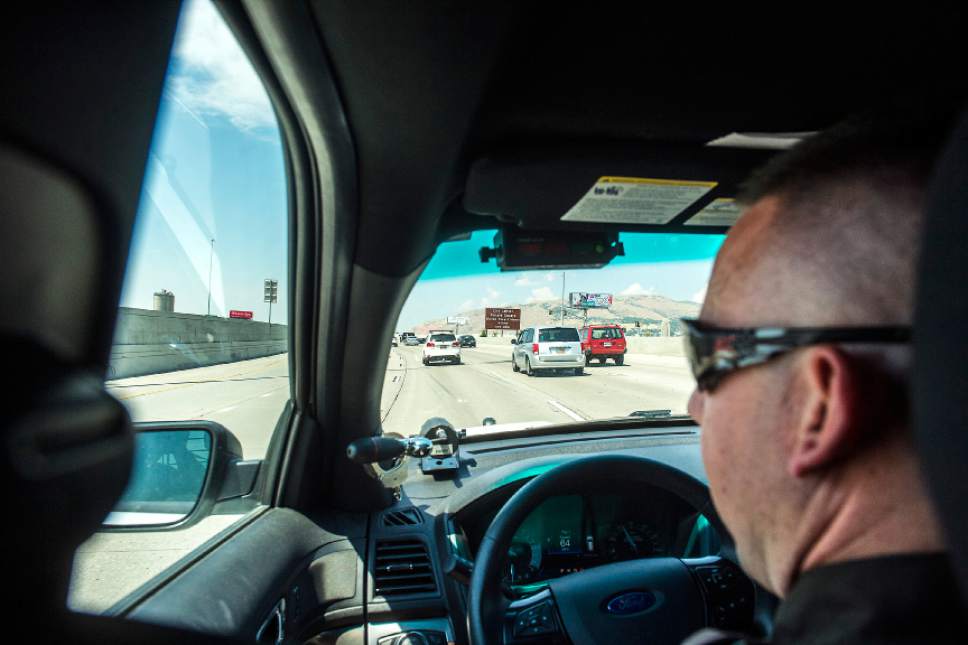 Chris Detrick  |  The Salt Lake Tribune

Utah Highway Patrol Trooper Derek Shelby looks for distracted drivers on Interstate 15 on Thursday, July 13, 2017.