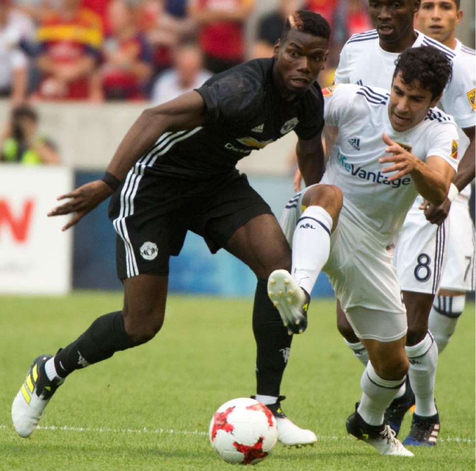Rick Egan  |  The Salt Lake Tribune

Manchester United midfielder Paul Pogba (6) goes for the ball along with Real Salt Lake defender Tony Beltran (2), as Real Salt Lake played Manchester United in a friendly game at Rio Tinto Stadium, Monday, July 17, 2017.