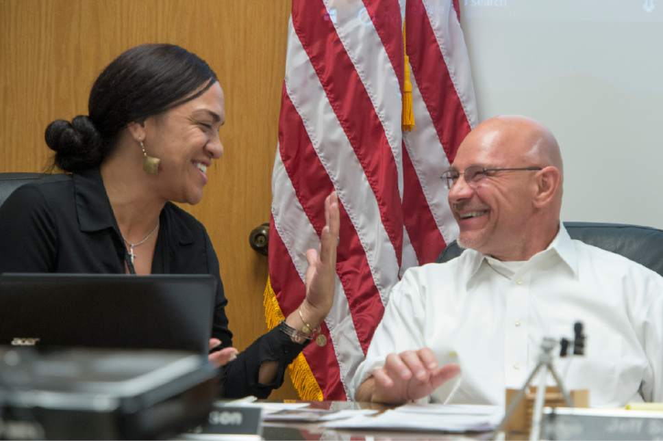 Rick Egan  |  The Salt Lake Tribune

Millcreek City Councilwoman Bev Uipi jokes with Mayor Jeff Silvestrini during the Millcreek City Council meeting Monday, July 10, 2017.