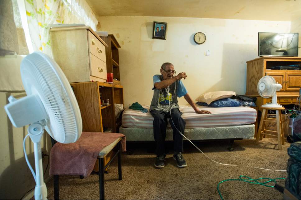Rick Egan  |  The Salt Lake Tribune

Juan Linares talks about how he survives in the hot summer in his South Salt Lake apartment. Friday, July 14, 2017.