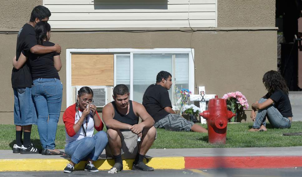 Al Hartmann  |  The Salt Lake Tribune 
Friends and family mourn at a memorial Thursday July 7 for a15-year-old girl and a 16-year-old boy, believed to have been shot about 11 p.m. Wednesday outside the Mill Creek II Apartments complex near 700 West and 7800 South.