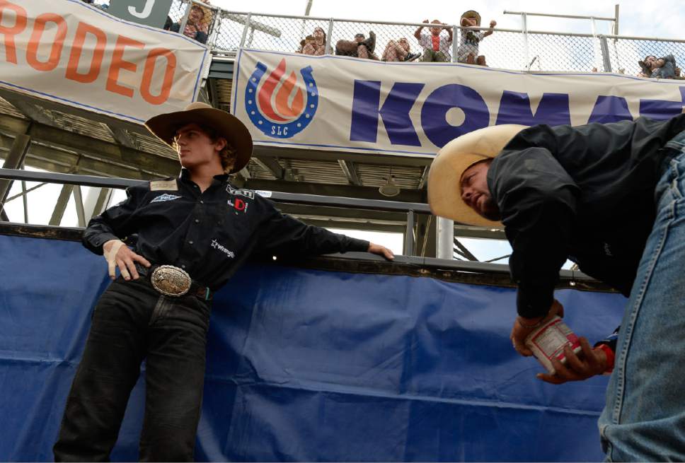 Francisco Kjolseth | The Salt Lake Tribune
Ryder Wright of Milford UT, left, is joined by his father Cody as they prepare for the championship saddle bronc riding competition alongside his sons Rusty, center, and Ryder at the new Fairpark Arena on day two of the Days of '47 Rodeo in its new home in Salt Lake City on Thursday, July 20, 2017.