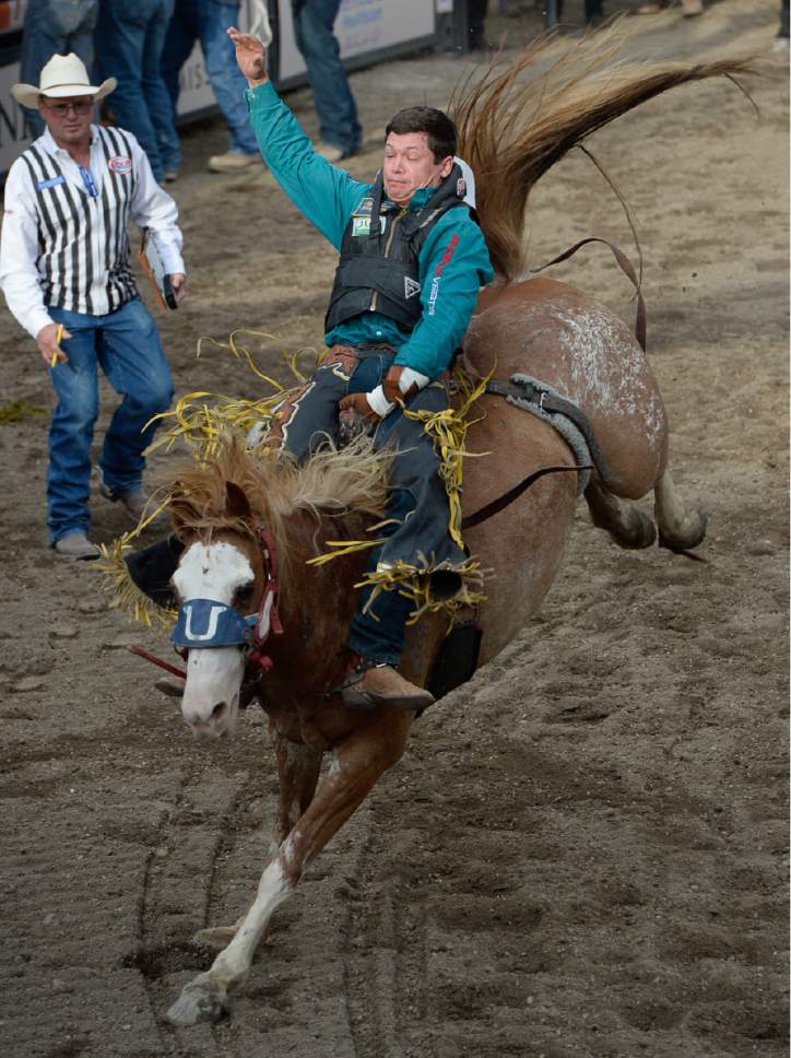 Francisco Kjolseth | The Salt Lake Tribune
Tanner Aus of Granite Falls, MN, competes in the championship bareback riding competition at Fairpark Arena on day two of the Days of '47 Rodeo in its new home in Salt Lake City on Thursday, July 20, 2017.