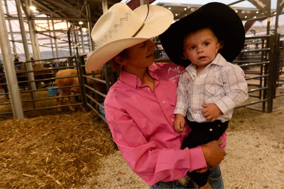 Francisco Kjolseth | The Salt Lake Tribune
Statler Wright, 13, holds his nephew Rookie, 1, after watching family members compete at Fairpark Arena on day two of the Days of '47 Rodeo in its new home in Salt Lake City on Thursday, July 20, 2017.