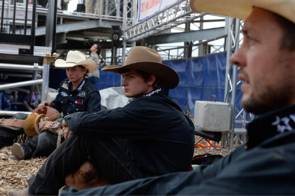 Francisco Kjolseth | The Salt Lake Tribune
Cody Wright of Milford UT, at right, prepares for the championship saddle bronc riding competition alongside his sons Rusty, left, and Ryder at the new Fairpark Arena on day two of the Days of '47 Rodeo in its new home in Salt Lake City on Thursday, July 20, 2017.