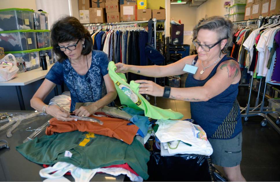 Al Hartmann  |  The Salt Lake Tribune
Volunteers Kathy Wagner, left, and Julie DeLay sort donated summer clothing for Volunteers of America, Utah homeless outreach workers to give  to people on the street.  With temperatures reaching the triple digits, Volunteers of America is asking for donations of bottled water to help homeless people stay hydrated. The nonprofit also is collecting sunscreen, Gatorade and summer clothing.