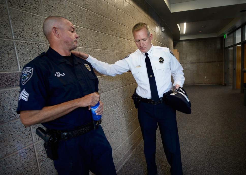 Scott Sommerdorf   |  The Salt Lake Tribune  
Sgt. Chad Reyes, left, and Sheriff Jim Winder speak in the hallway prior to the memorial service for "Dingo," a Unified Police Department dog shot and killed in the line of duty July 6 while working with his K-9 handler Sgt. Chad Reyes, Saturday, July 15, 2017.