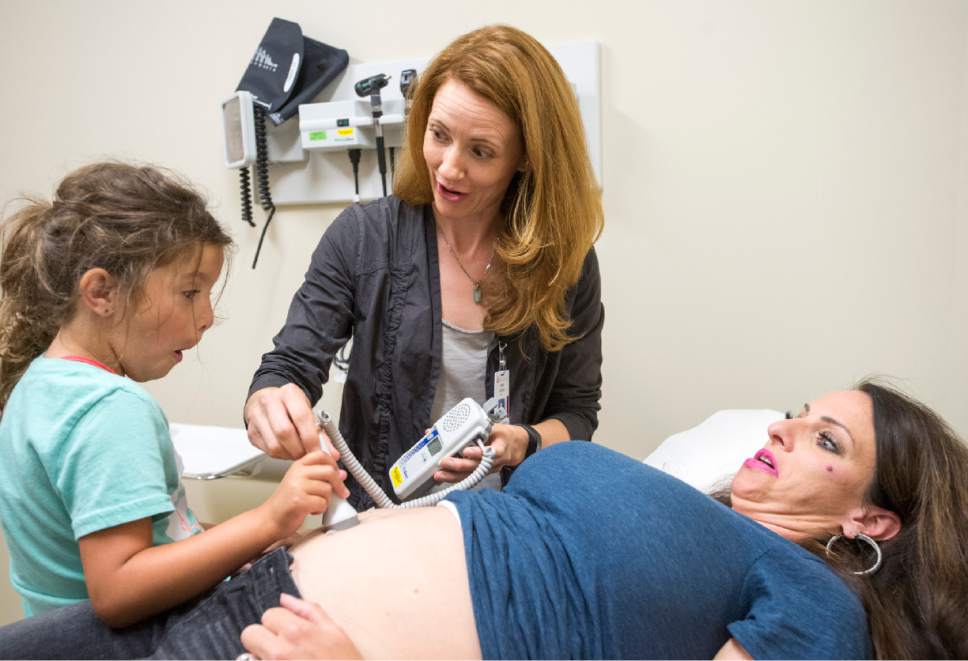 Rick Egan  |  The Salt Lake Tribune
Erin Clark, an obstetrics/gynecology specialist at the University of Utah,  listens to Shawna Richardson's baby's heart beat with the assistance of Shawna's 6-year-old daughter Annabelle,  at the University of Utah Daybreak Health Center, Wednesday, July 19, 2017. A new study indicates Salt Lake City may be facing a shortage of OB-GYN physicians.