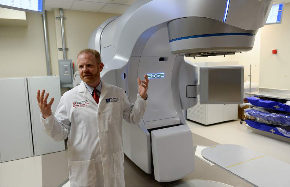 Francisco Kjolseth | The Salt Lake Tribune
Radiation Oncologist Dr. Matthew Poppe at Huntsman Cancer Institute describes the process of using a linear accelerator or high energy photon X-Ray machine that actively breaks the DNA of rapidly dividing double strand cells. A recently completed Phase II clinical trial demonstrates that a shorter course of radiation may be a good option for breast cancer patients who need radiation following a mastectomy. The Phase III trial will be led by Dr. Poppe and is expected to enroll approximately 900 patients at HCI and numerous additional cancer centers throughout the U.S. and Canada.