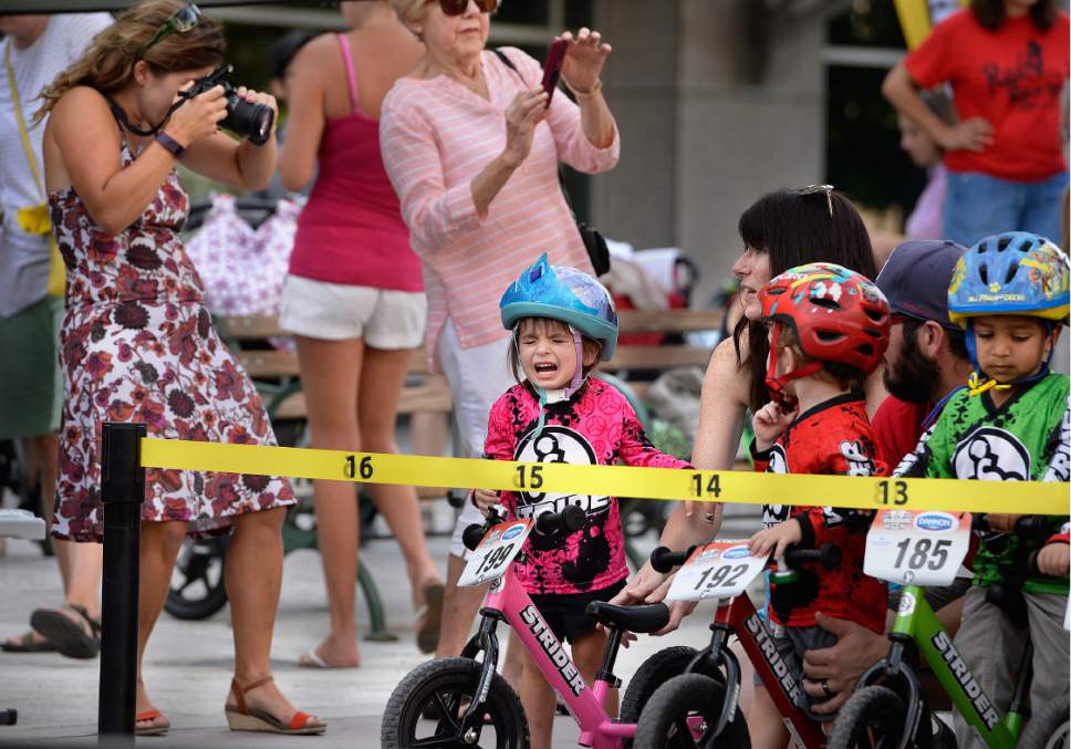Scott Sommerdorf   |  The Salt Lake Tribune  
Two year old Andi Hansen of Herriman, isn't enjoying the moments before the start of her heat at the Strider World Championships, held at the Gallivan Center, Saturday, July 22, 2017.