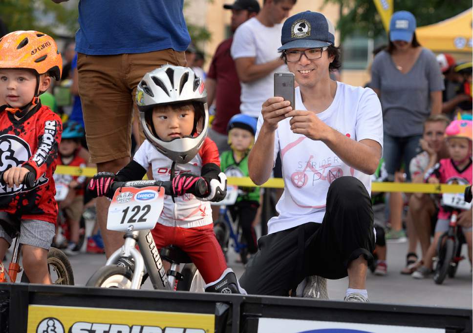 Scott Sommerdorf   |  The Salt Lake Tribune  
Two year old Hinaki Takao from Japan, waits for the starter's signal as his father is ready to record his race prior to his heat at the Strider World Championships, held at the Gallivan Center, Saturday, July 22, 2017.