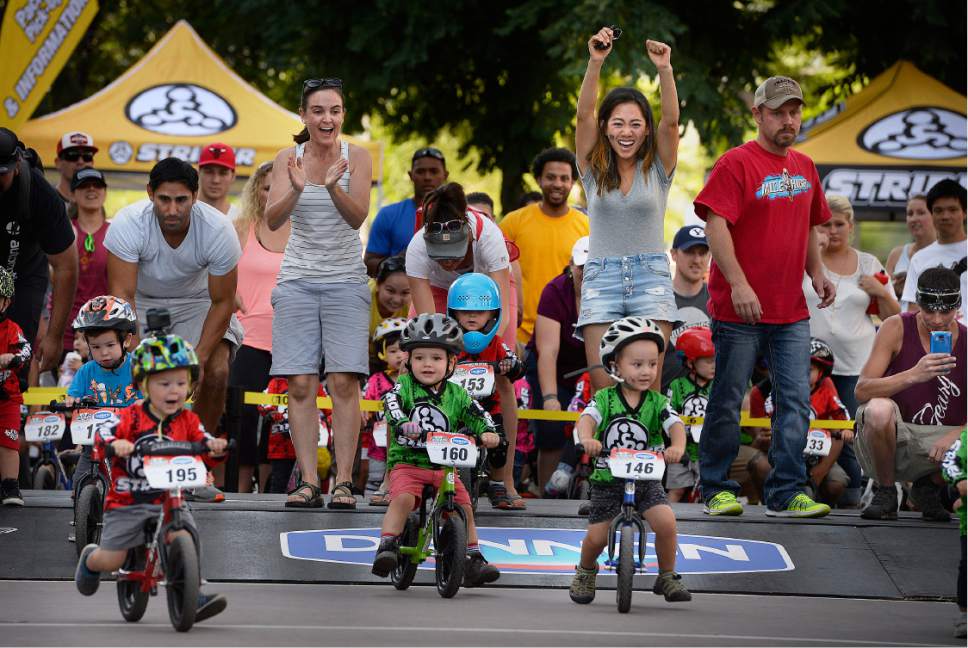 Scott Sommerdorf   |  The Salt Lake Tribune  
Moms, including Manunya Simpson, right, cheer as their children set off on their heat race in the two year old division at the Strider World Championships, held at the Gallivan Center, Saturday, July 22, 2017. Simpson was cheering for her son, Desmond, #146.