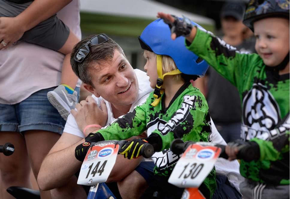 Scott Sommerdorf   |  The Salt Lake Tribune  
Josh Sterner of Salt Lake City gives his son, Jake, a pep talk prior to his race at the Strider World Championships at the Gallivan Center on Saturday.