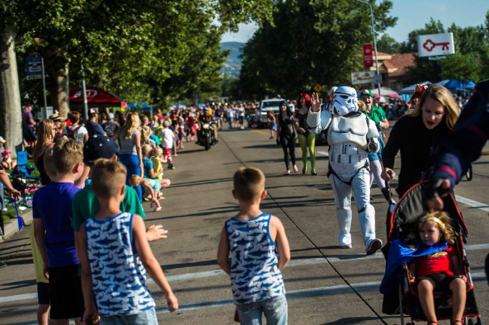 Chris Detrick  |  The Salt Lake Tribune
Cosplayers with Salt Lake Comic Con wave to the crowd during the 65th annual Bountiful Handcart Days Grand Parade Friday, July 21, 2017.