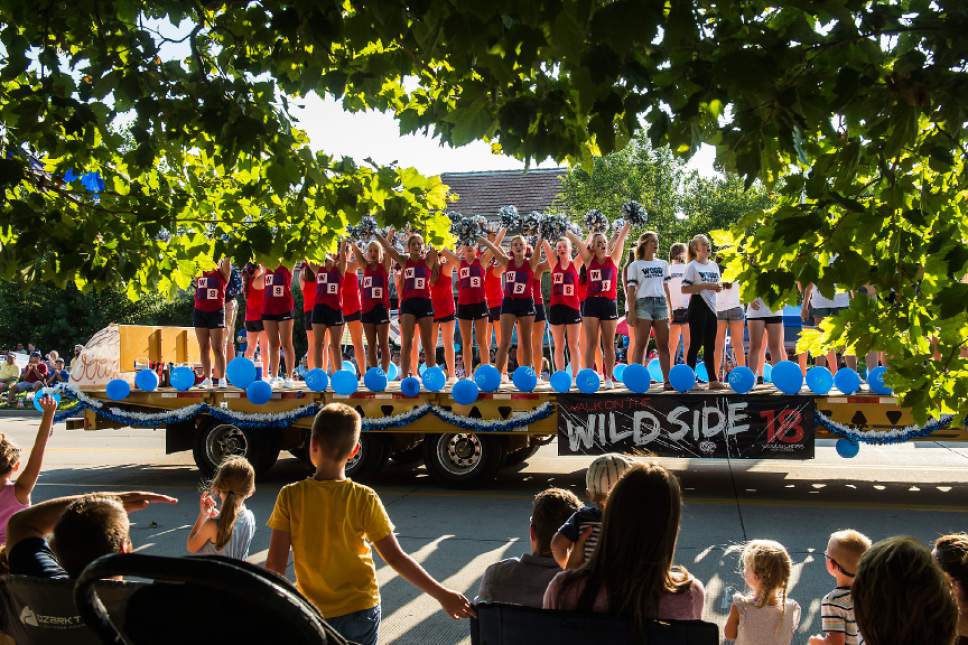Chris Detrick  |  The Salt Lake Tribune
Woods Cross cheerleaders cheer during the 65th annual Bountiful Handcart Days Grand Parade Friday, July 21, 2017.