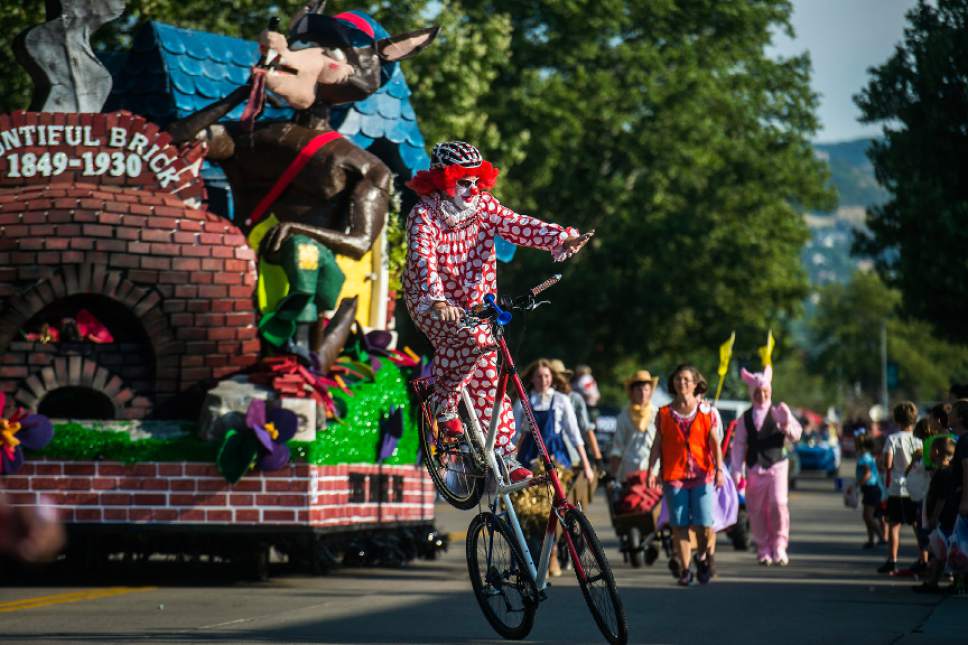 Chris Detrick  |  The Salt Lake Tribune
A clown rides a bike during the 65th annual Bountiful Handcart Days Grand Parade Friday, July 21, 2017.
