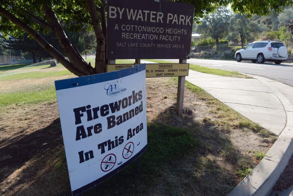Al Hartmann  |  The Salt LakeTribune
Sign at the entrance to Bywater Park warning of fireworks ban.  Across the street near 3080 E. 7420 S. a home was burned from a fire starting in a dry field last night Tuesday July 4, presumably by firewowrks.