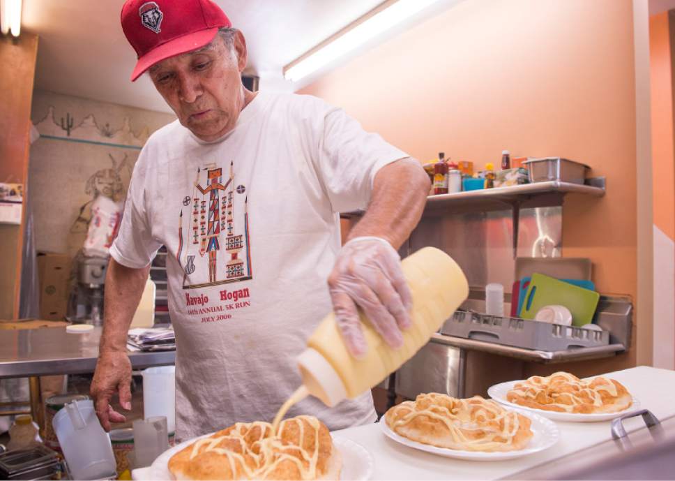 Leah Hogsten  |  The Salt Lake Tribune
Bill Espinoza, owner of Navajo Hogan, serves sweet fry bread and traditional Navajo tacos at his restaurant in Salt Lake City, July 19, 2017.