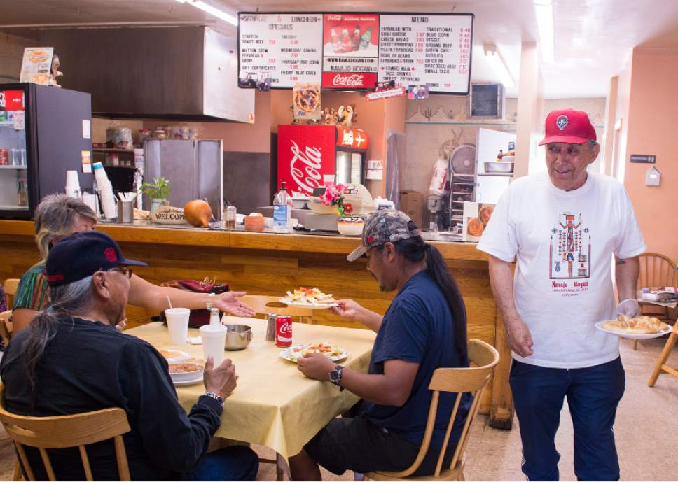 Leah Hogsten  |  The Salt Lake Tribune
Bill Espinoza, owner of Navajo Hogan, laughs with customers as he serves sweet fry bread and traditional Navajo tacos at his restaurant in Salt Lake City, July 19, 2017.
