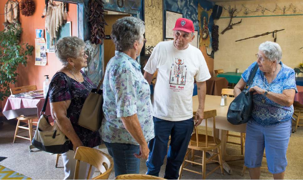 Leah Hogsten  |  The Salt Lake Tribune
Bill Espinoza, owner of Navajo Hogan (center) welcomes his Wednesday regulars-- sisters l-r Janet Drake, Marilyn Gillman and Luana Hadfield. Espinoza serves sweet fry bread and traditional Navajo tacos at his restaurant, knows regulars by name and their order.