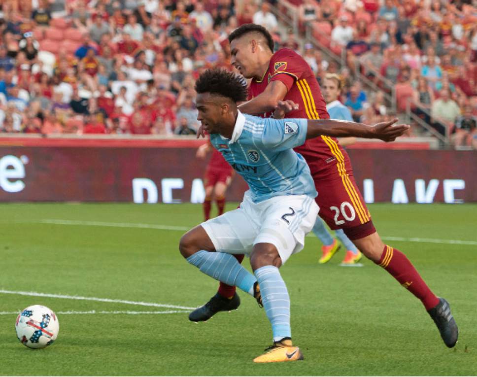 Michael Mangum  |  Special to the Tribune

Sporting Kansas City defender Erik Palmer-Brown (2) shields Real Salt Lake midfielder Luis Silva (20) from the ball as it rolls toward the end line during their match at Rio Tinto Stadium in Sandy, UT on Saturday, July 22, 2017.