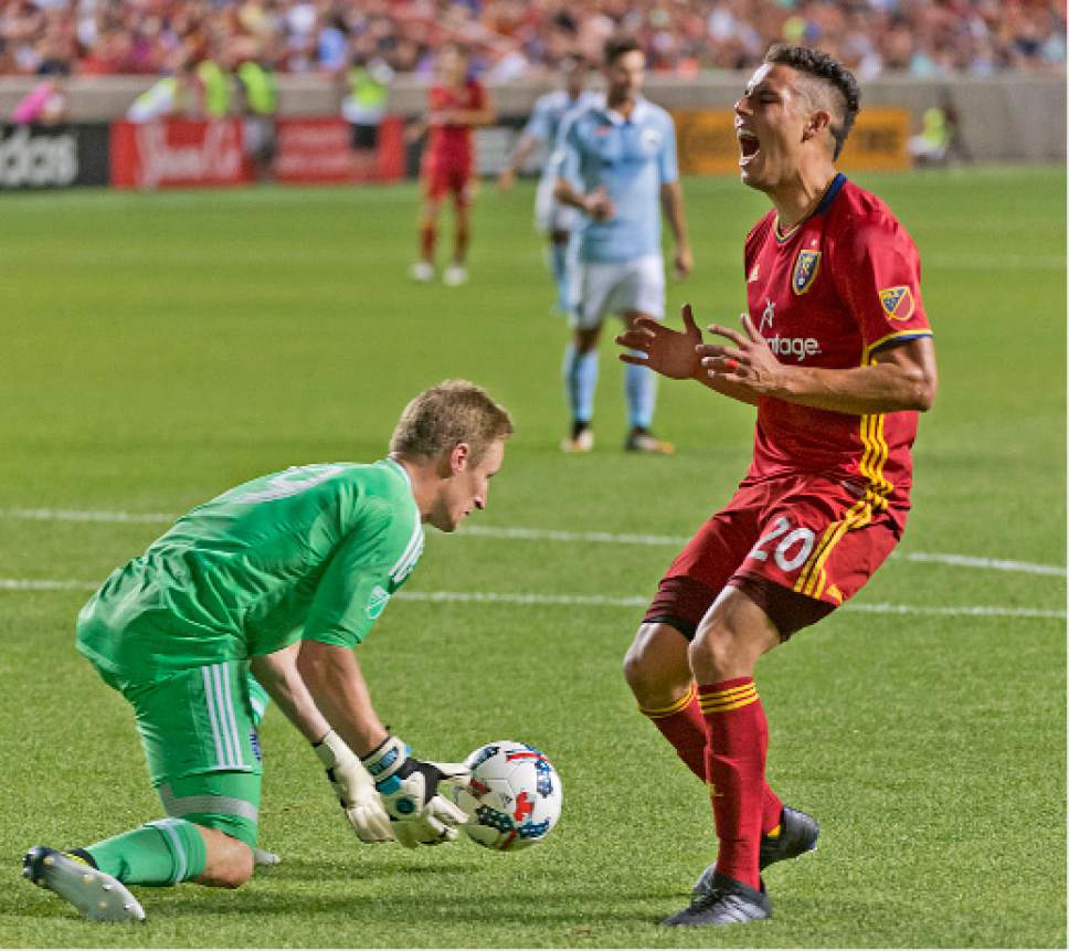 Michael Mangum  |  Special to the Tribune

Real Salt Lake midfielder Luis Silva (20) groans after a missed opportunity as Sporting Kansas City goalkeeper Tim Melia (29) scoops up the ball during their match at Rio Tinto Stadium in Sandy, UT on Saturday, July 22, 2017.