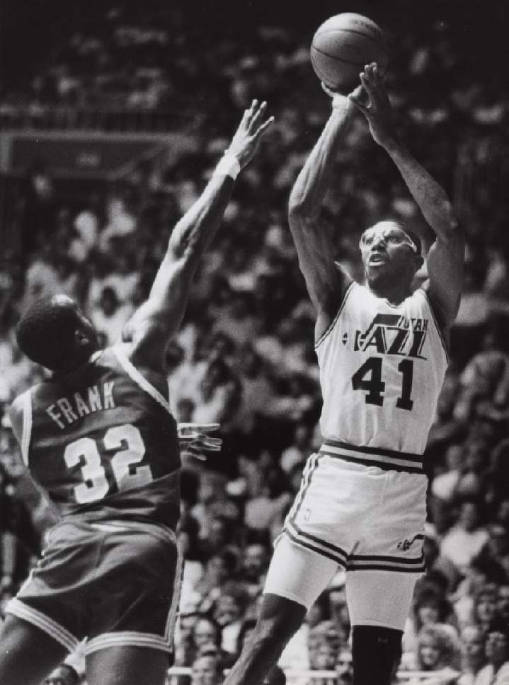 Tribune file photo

Thurl Bailey shoots over Tellis Frank in this 1989 photo.