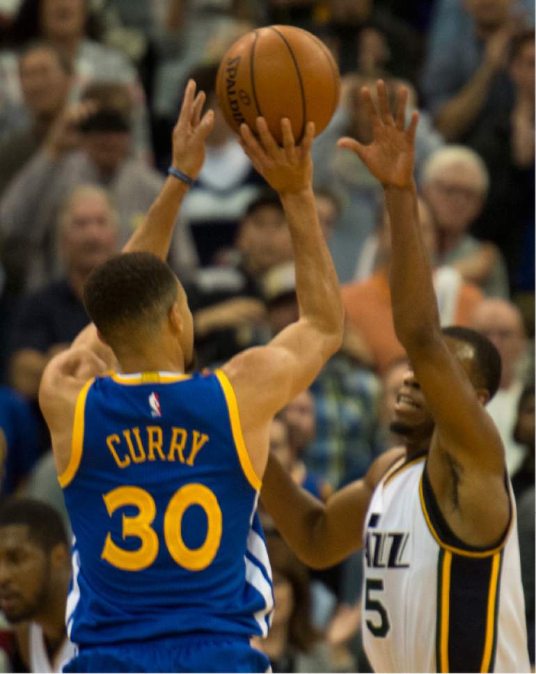 Rick Egan  |  The Salt Lake Tribune

Golden State Warriors guard Stephen Curry (30) shoots a 3-point shot over Utah Jazz guard Rodney Hood (5), giving the Warriors a 104-101 lead with 49 seconds left in the game,  in NBA action the Utah Jazz vs. the Golden State Warriors, in Salt Lake City, Monday, November 30, 2015.
