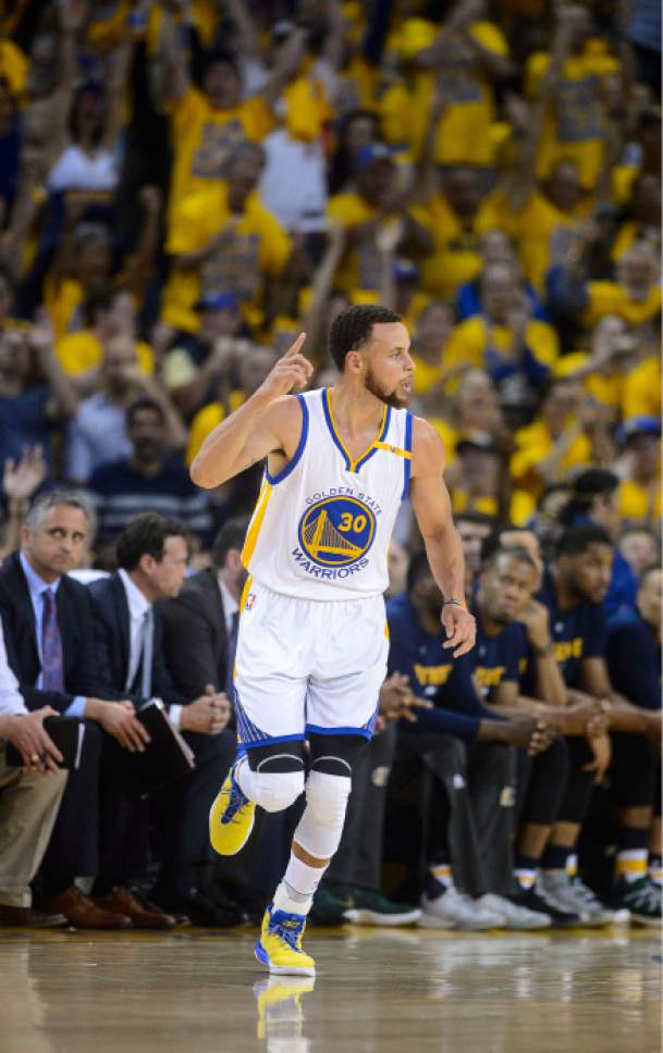 Steve Griffin  |  The Salt Lake Tribune


Golden State Warriors guard Stephen Curry (30) heads up court after hitting a three during NBA playoff game between the Utah Jazz and the Golden State Warriors at Oracle Arena in Oakland Tuesday May 2, 2017.