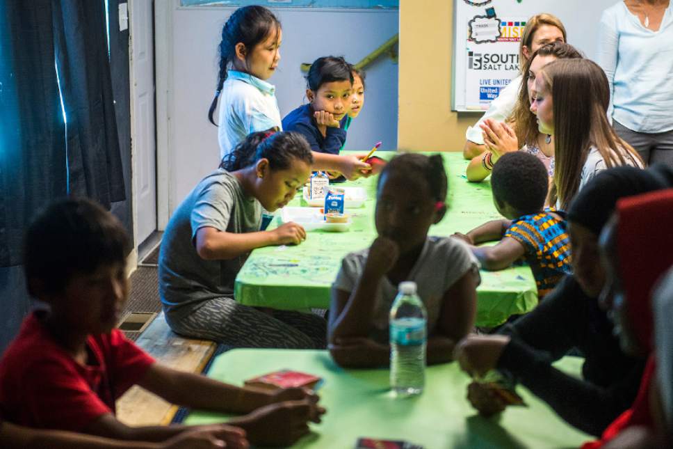 Chris Detrick  |  The Salt Lake Tribune

Children play cards and eat snacks at the Hser Ner Moo Community Center in South Salt Lake on Tuesday, July 18, 2017.