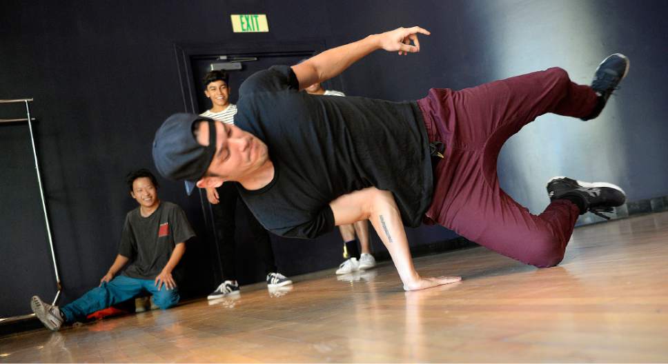 Al Hartmann  |  The Salt Lake Tribune
Joshua Perkin shows off his moves as a lead member of the BBoy Federation, a non-profit for Hip Hop Arts at an announcement of the line-up and headliners for the 2017 Urban Arts Festival (Sept. 16-17) held at the Gallivan Center.