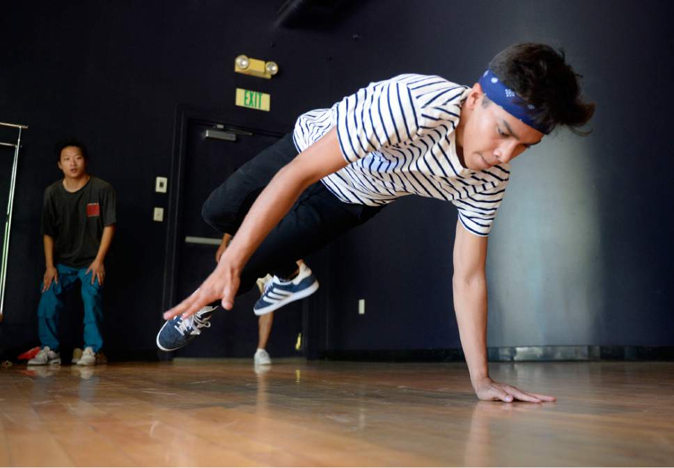 Al Hartmann  |  The Salt Lake Tribune
Nick Allred shows off his moves as a member of the BBoy Federation, a non-profit for Hip Hop Arts at an announcement of the line-up and headliners for the 2017 Urban Arts Festival (Sept. 16-17) held at the Gallivan Center.