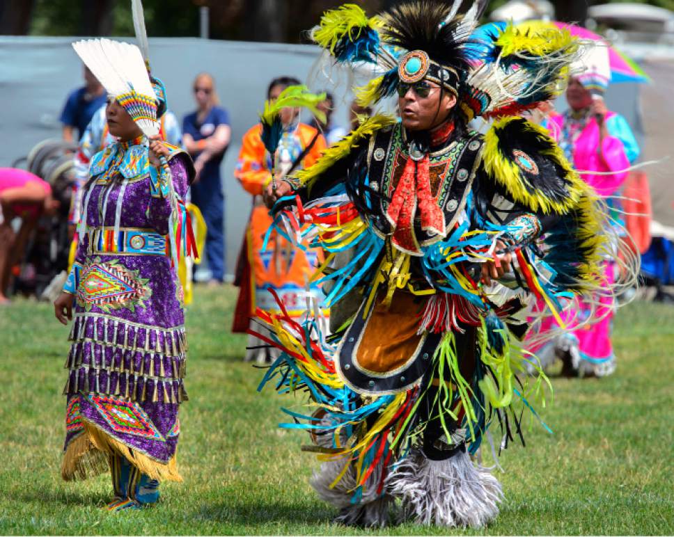 Steve Griffin  |  The Salt Lake Tribune


Honorary Head Man Rog Benally, of the Navajo Tribe, right, dances with Honorary Head Lady Latanya Robinson, of the Navajo Tribe, during the opening ceremony during the  Native American Powwow & Festival at Liberty Park in Salt Lake City on Monday, July 24, 2017.