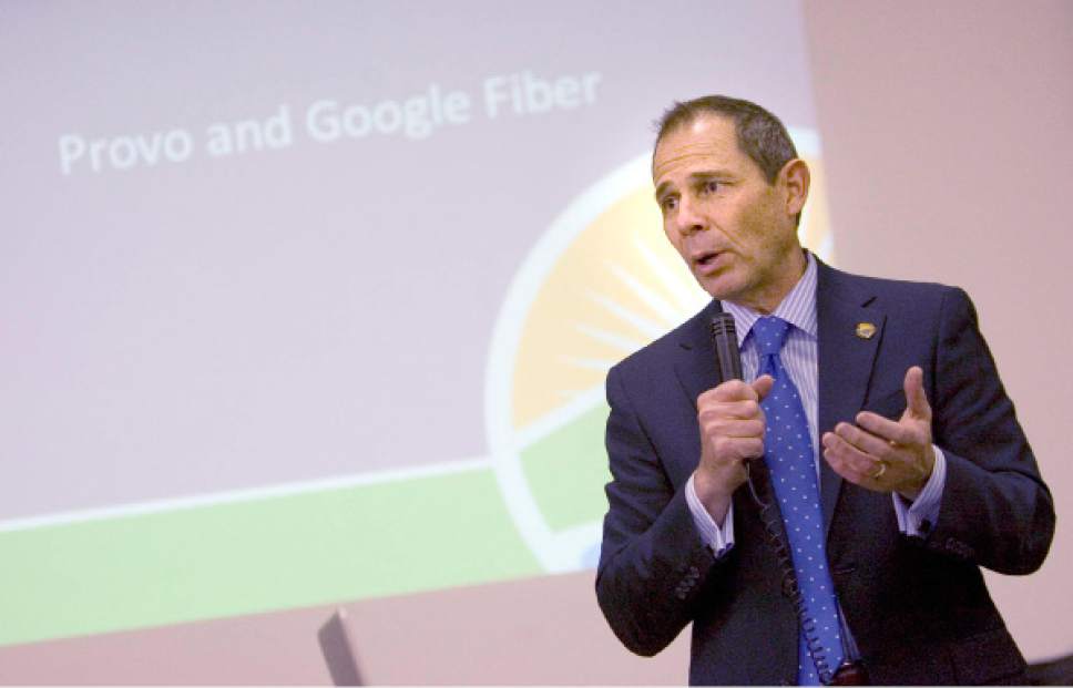 Tribune File Photo
Provo  Mayor John Curtis discusses the Google Fiber network at a public question and answer meeting at Provo's Edgemont School on Thursday, April 18, 2013.