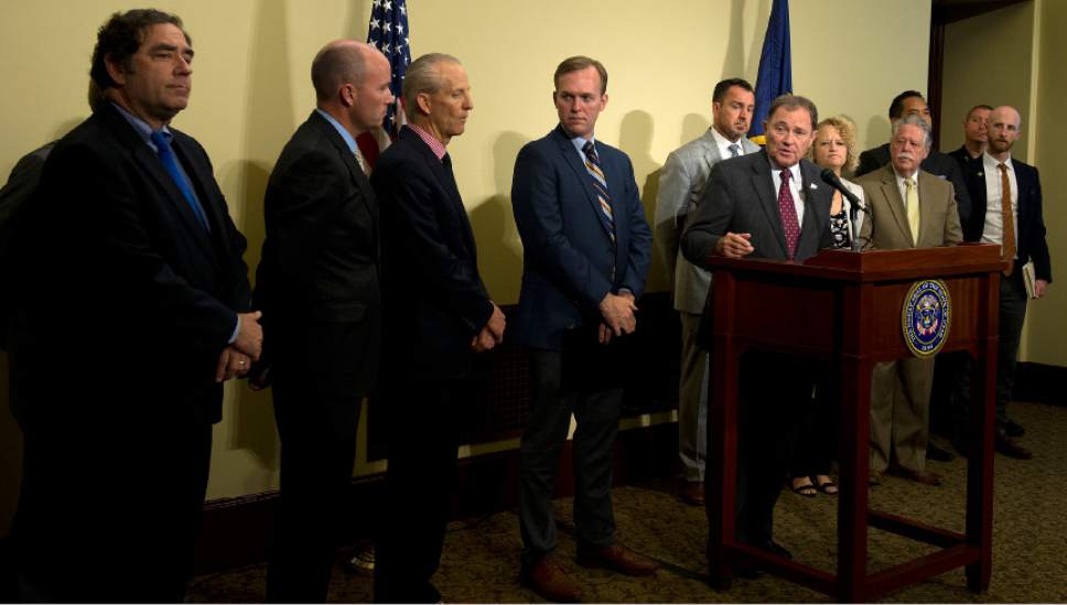 Leah Hogsten  |  The Salt Lake Tribune
l-r More cops, more money and more behavioral treatment beds are needed said Governor Gary Herbert to combat lawlessness in the Rio Grande district in downtown Salt Lake City. "It's going to take a collaborative effort between the city, county and state," said Herbert, who was joined by other state leaders during Wednesday's press conference at the Capitol.