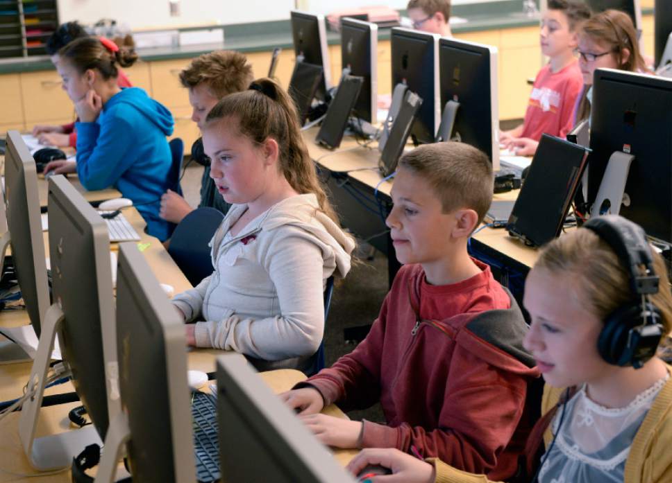 Al Hartmann  |  Tribune file photo
Sixth graders study at Fox Hollow Elementary School in Lehi in 2014. State lawmakers are reviewing slow adoption of computer-enhanced teaching in Utah classrooms.
